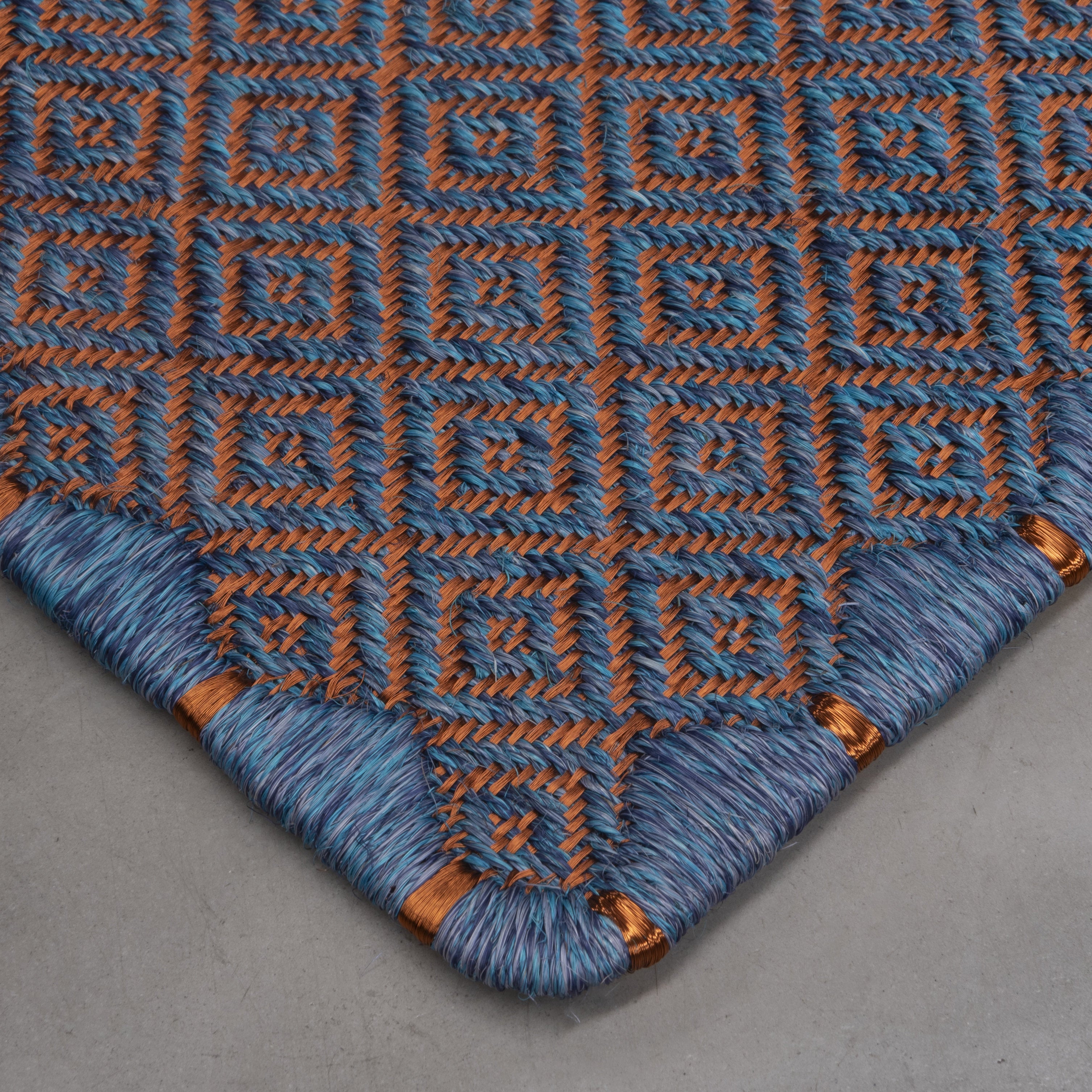 MEDIUM RHOMBUS WEAVE RUG IN TAYRONA BLUE FIQUE FIBER WITH COPPER