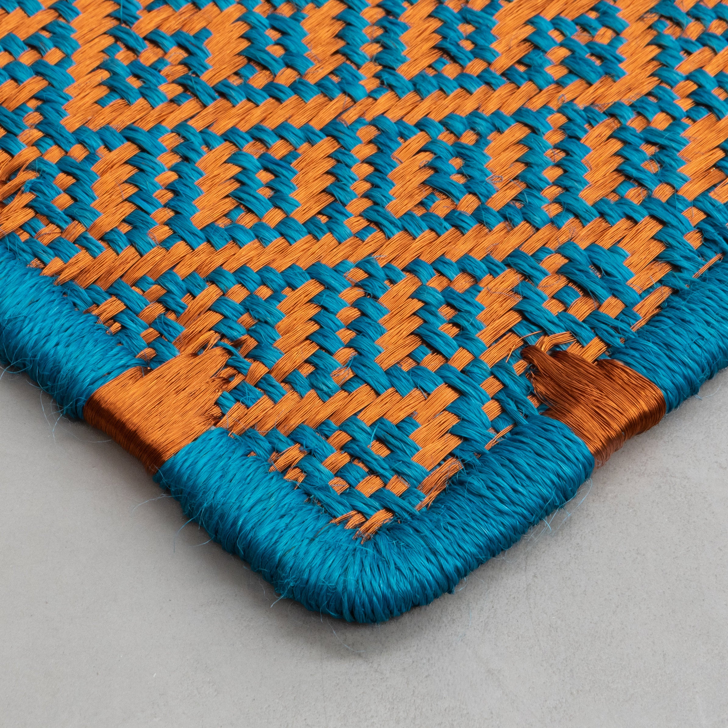 DAU WEAVE RUG IN TURQUOISE FIQUE FIBER AND COPPER