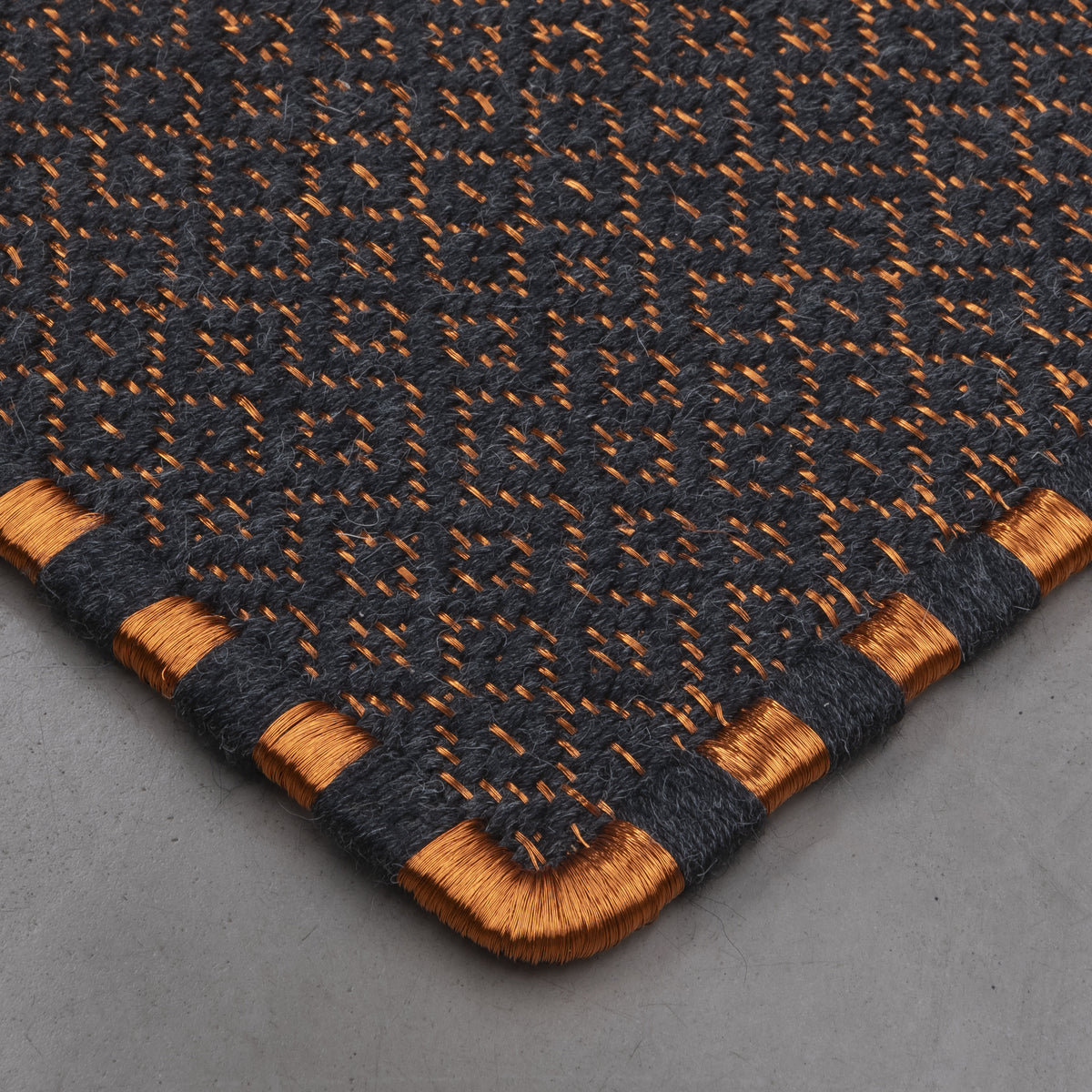 SUSU WEAVE RUG IN COPPER AND BLACK ALPACA