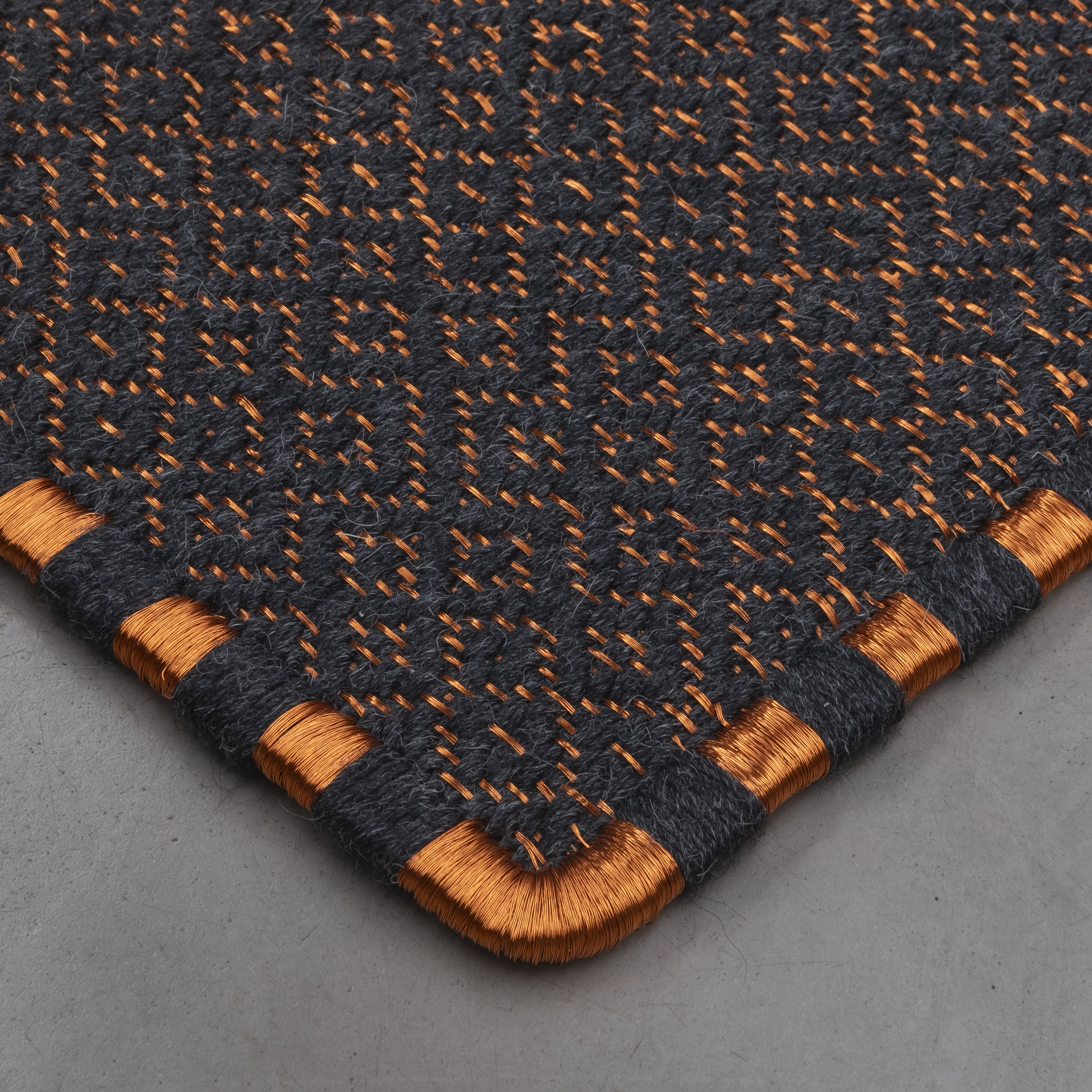 SUSU WEAVE RUG IN COPPER AND BLACK ALPACA