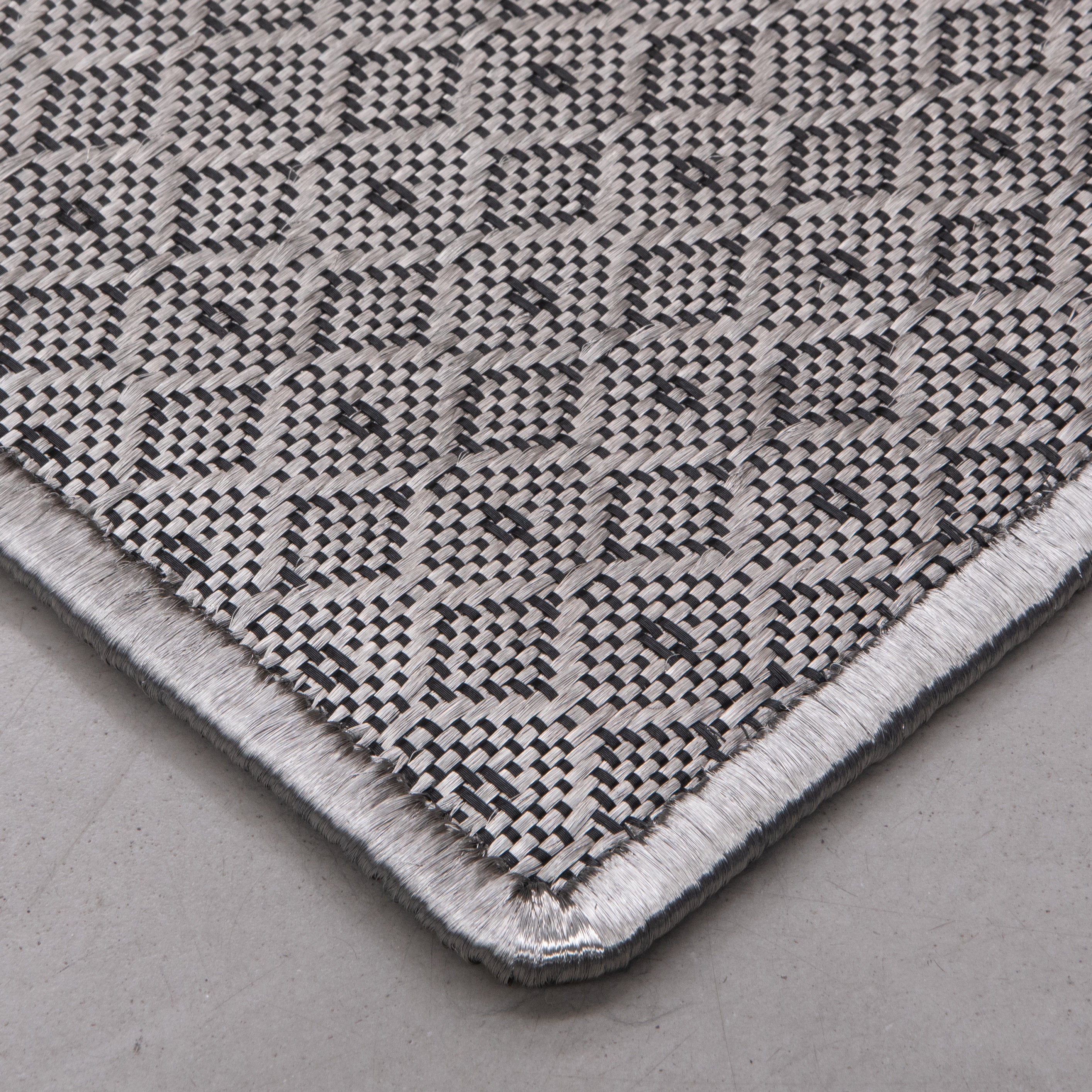 ALUNA WEAVE RUG IN BLACK ACRYLIC AND STAINLESS STEEL