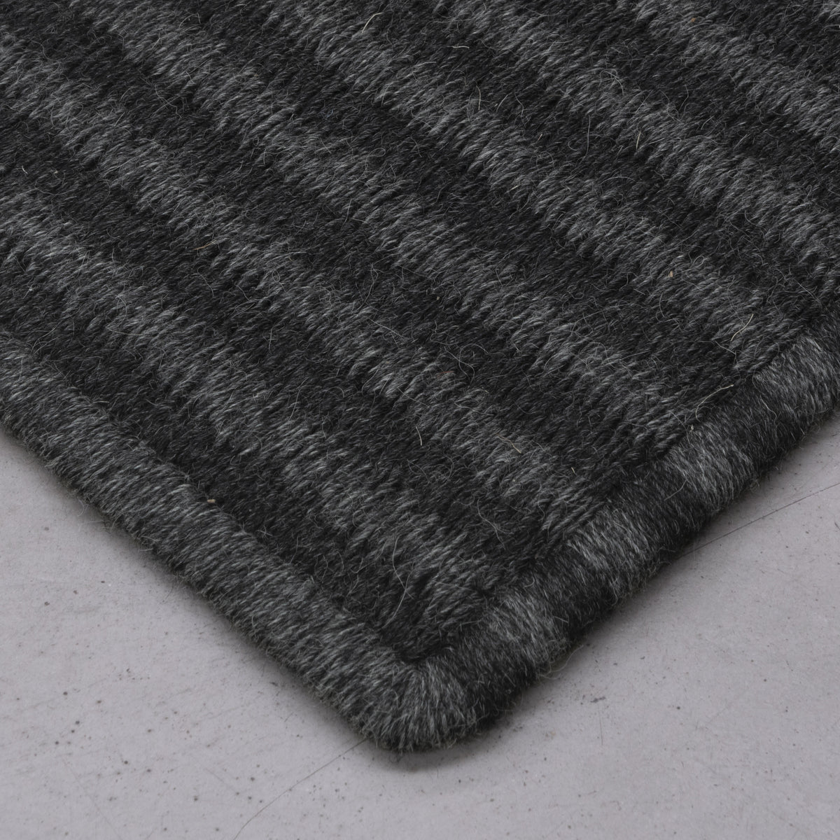 STRIPES WEAVE RUG IN BLACK ALPACA AND BLACK-GRAY ALPACA